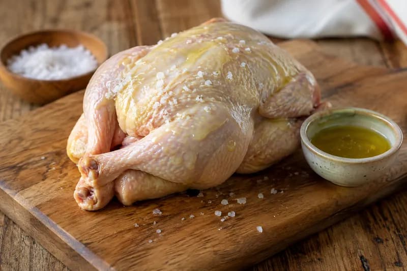 Ofen vorheizen und Poulet einreiben